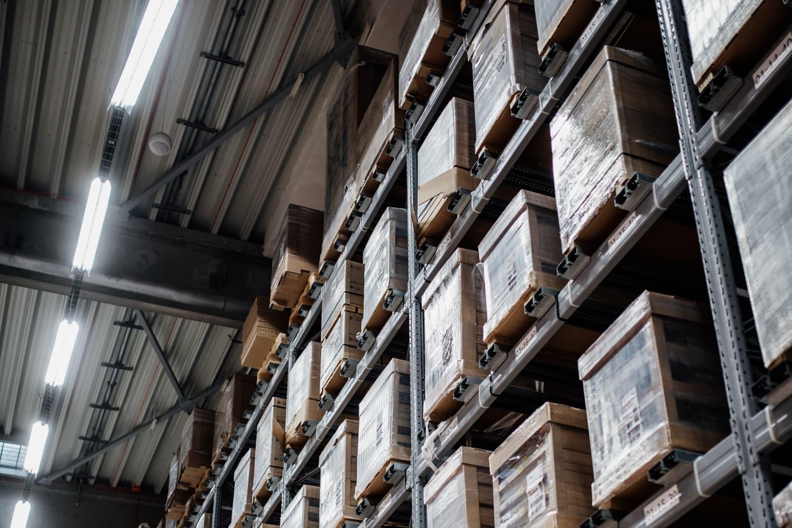 Warehouse racking and wrapped pallets in a distribution centre.