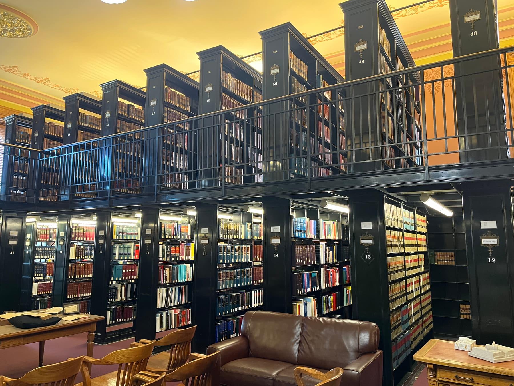 Bookshelves in a law library, with a reading table and no people.